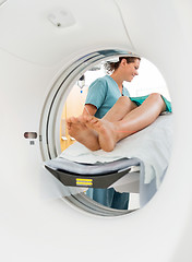 Image showing Nurse Looking At Patient Undergoing CT Scan