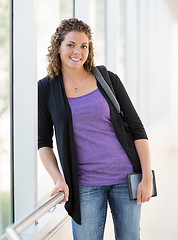 Image showing Happy Female Student With Digital Tablet And Backpack