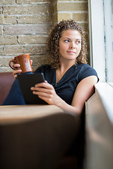 Image showing Woman With Coffee Mug And Digital Tablet In Cafe
