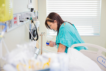 Image showing Pregnant Woman Holding Nitrous Oxide Mask In Hospital Room