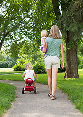 Image showing Mother With Children Strolling In Park