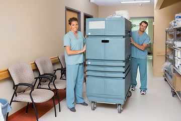 Image showing Nurses Pushing Trolley In Hospital Hallway