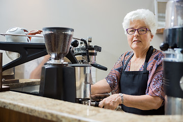 Image showing Portrait of Senior Barista Preparing Coffee
