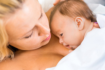 Image showing Babygirl Resting On Mother