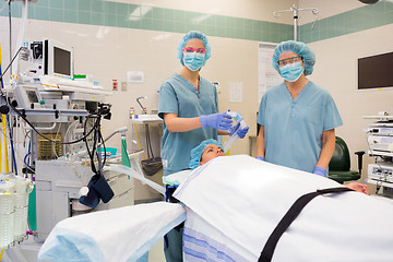 Image showing Nurses With Oxygen Mask Preparing Patient