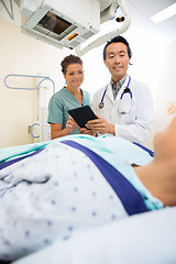 Image showing Medical Team Looking At Patient On Xray Table