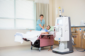 Image showing Portrait Of Nurse By Patient Receiving Renal Dialysis