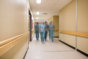 Image showing Multiethnic Medical Team Walking In Hospital Corridor