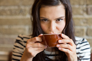 Image showing Closeup Of Woman Drinking Coffee At Cafe