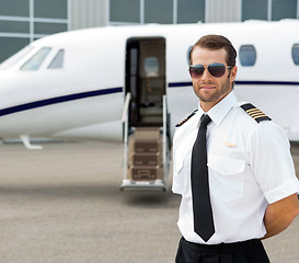 Image showing Confident Pilot Wearing Sunglasses