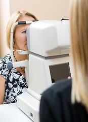 Image showing Optometrist Using Tonometer to Measure Patients Eye Pressure