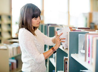 Image showing Student Selecting Books In Bookstore