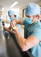 Image showing Sterilizing Hands and Arms Before Surgery