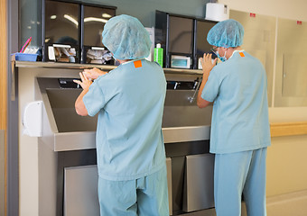 Image showing Surgeons Washing Hands At Washbasin