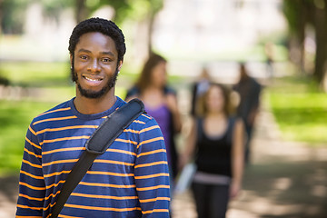 Image showing Young Male Grad Student Smiling On Campus