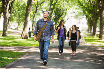 Image showing Confident Male Grad Student Walking On Campus