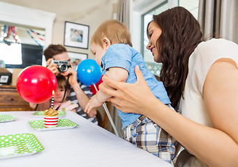 Image showing Family Celebrating Son's Birthday At Home