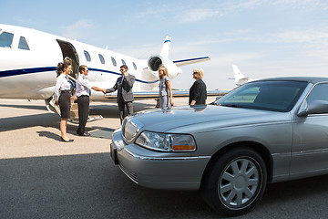 Image showing Business Professional Greeting Airhostess And Pilot