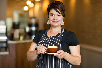 Image showing Barista in Small Cafe