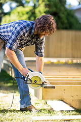 Image showing Carpenter Using Circular Saw