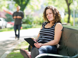 Image showing Student Relaxing On Bench At University Campus