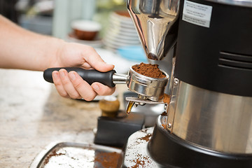 Image showing Barista Holding Portafilter With Ground Coffee