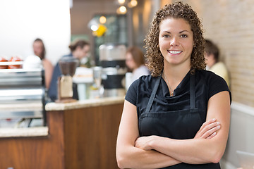 Image showing Happy Owner Standing Arms Crossed In cafe