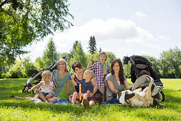 Image showing Mothers And Children Enjoying Picnic