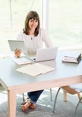 Image showing Student Using Digital Tablet And Laptop In Library