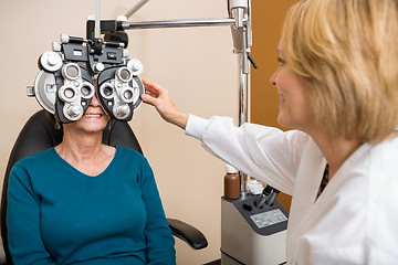 Image showing Optician Examining Patient's Vision