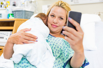 Image showing Patient Taking Self Portrait With Babygirl Through Smart Phone