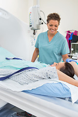 Image showing Nurse Preparing Patient For CT Scan