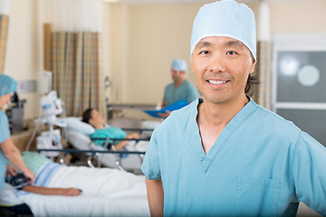 Image showing Smiling Male Nurse Standing In Hospital Ward