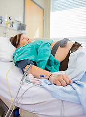 Image showing Pregnant Woman With Fetal Monitoring Belts