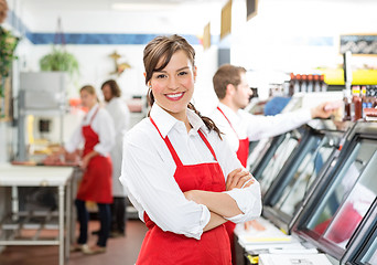 Image showing Confident Female Butcher Standing Arms Crossed