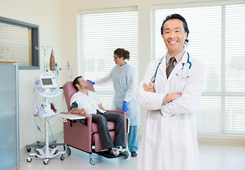 Image showing Doctor With Patient Being Examined By Heartbeat Machine