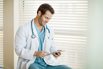 Image showing Cancer Specialist Using Digital Tablet At Clinic
