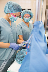 Image showing Nurse Adjusting Oxygen Mask On Patient