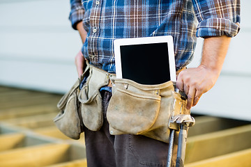 Image showing Construction Worker With Tablet Computer In Toolbelt