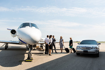 Image showing Business People With Pilot And Airhostess At Terminal