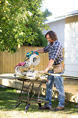 Image showing Carpenter using Table Saw