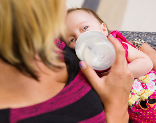 Image showing Mother Feeding Milk To Newborn Baby Girl