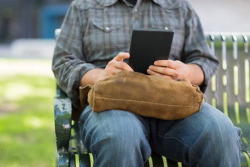 Image showing Midsection Of University Student Using Digital Tablet