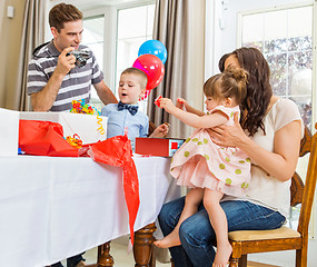 Image showing Family Opening Birthday Presents