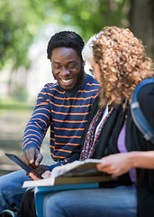 Image showing Happy Student Using Digital Tablet With Friends On Campus