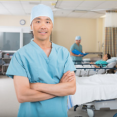 Image showing Male Nurse Standing In Hospital Ward