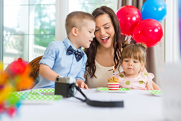 Image showing Mother And Children Celebrating Birthday