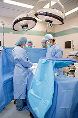 Image showing Doctors Operating on Patient