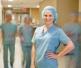 Image showing Doctor With Team Walking At Hospital Corridor