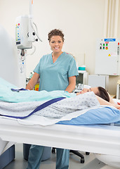 Image showing Female Nurse With Patient In CT Scan Room